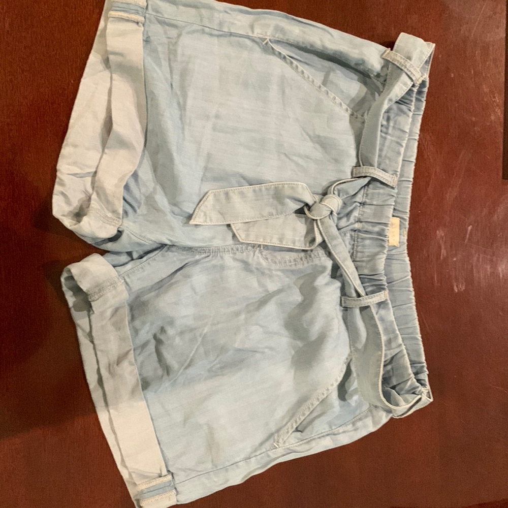 Hinge pull on elastic waist shorts with belt.